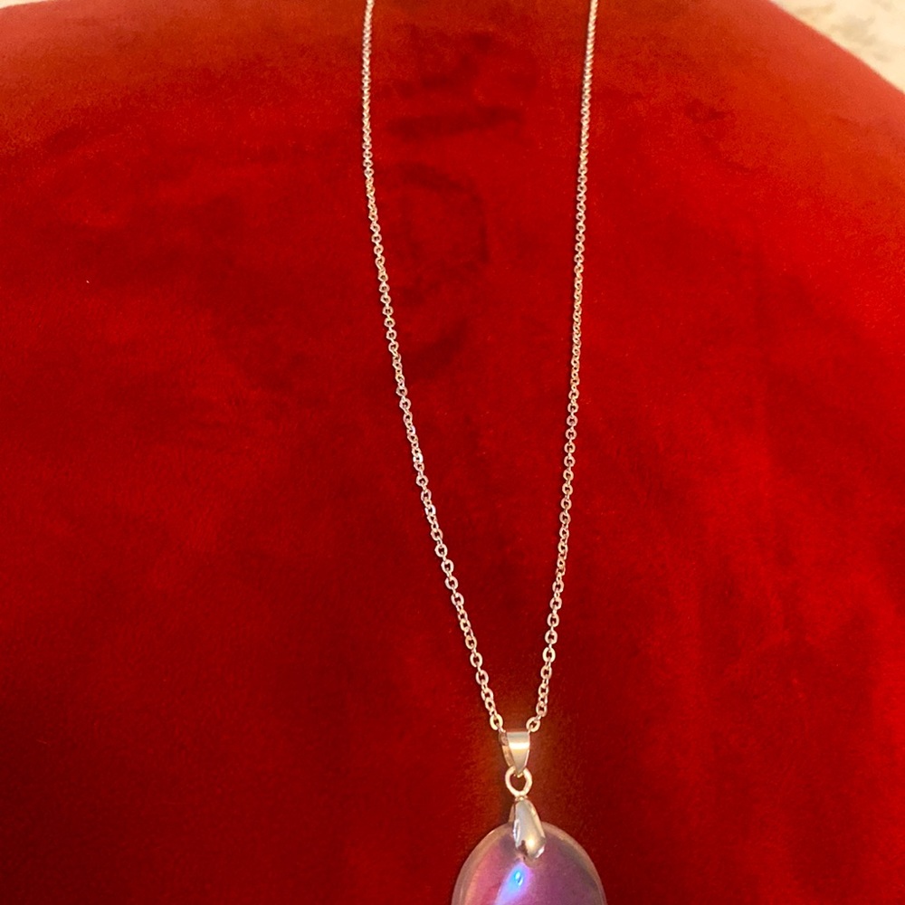 Beautiful angel aura pendant on sparkling chain.